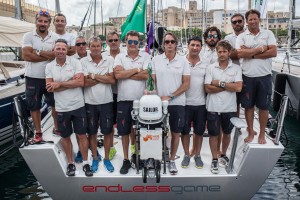 Il Red Devil Sailing Team a bordo di endlessgame con il trofeo vinto nella regata costiera della Rolex Middle Sea Race