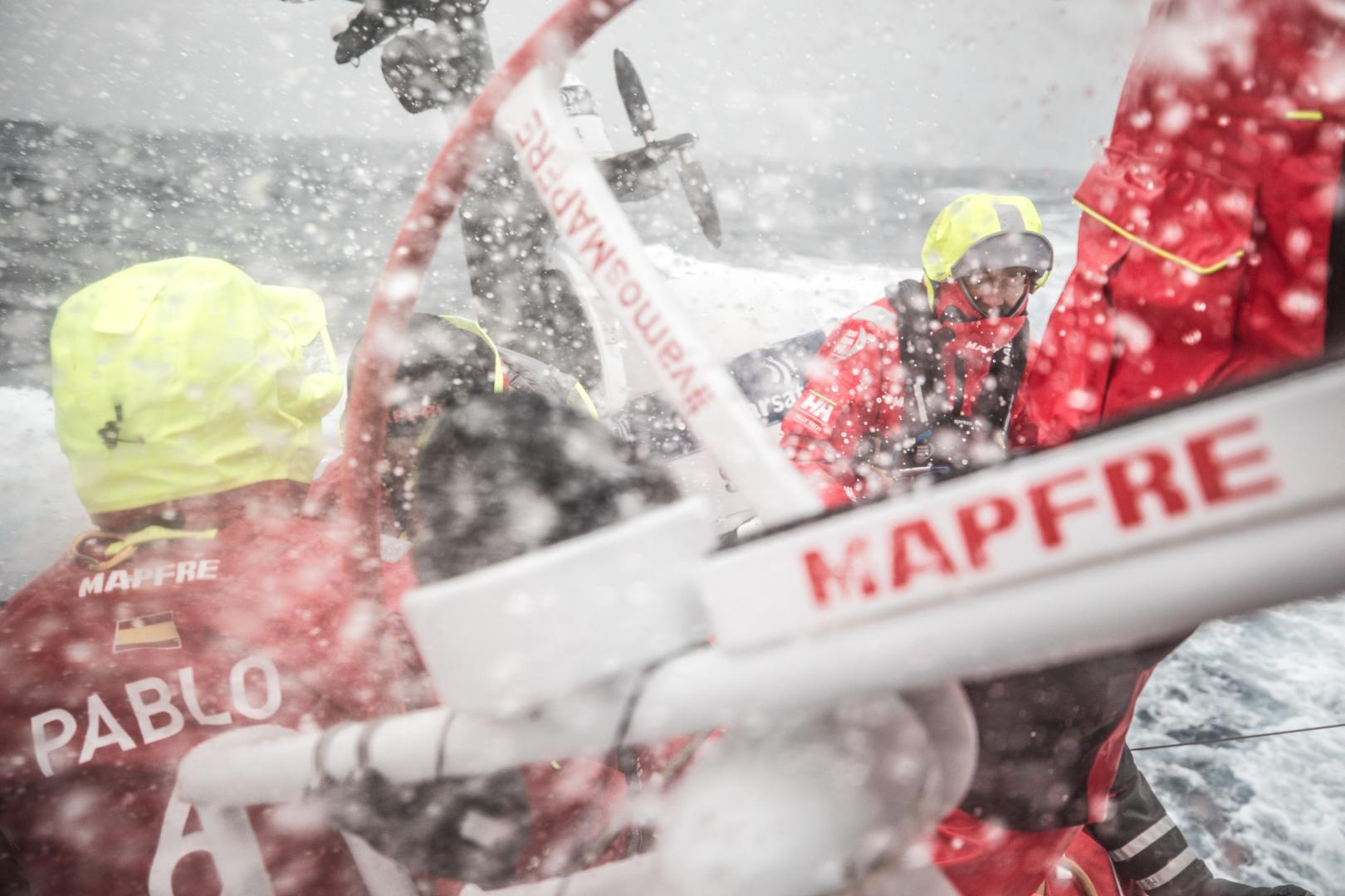 Volvo Ocean Race Leg 02, Lisbon to Cape Town, day 17, on board MAPFRE, Sophie Ciszek at the stern holding the main sheet, Pablo Arrarte backwards to the splashing water