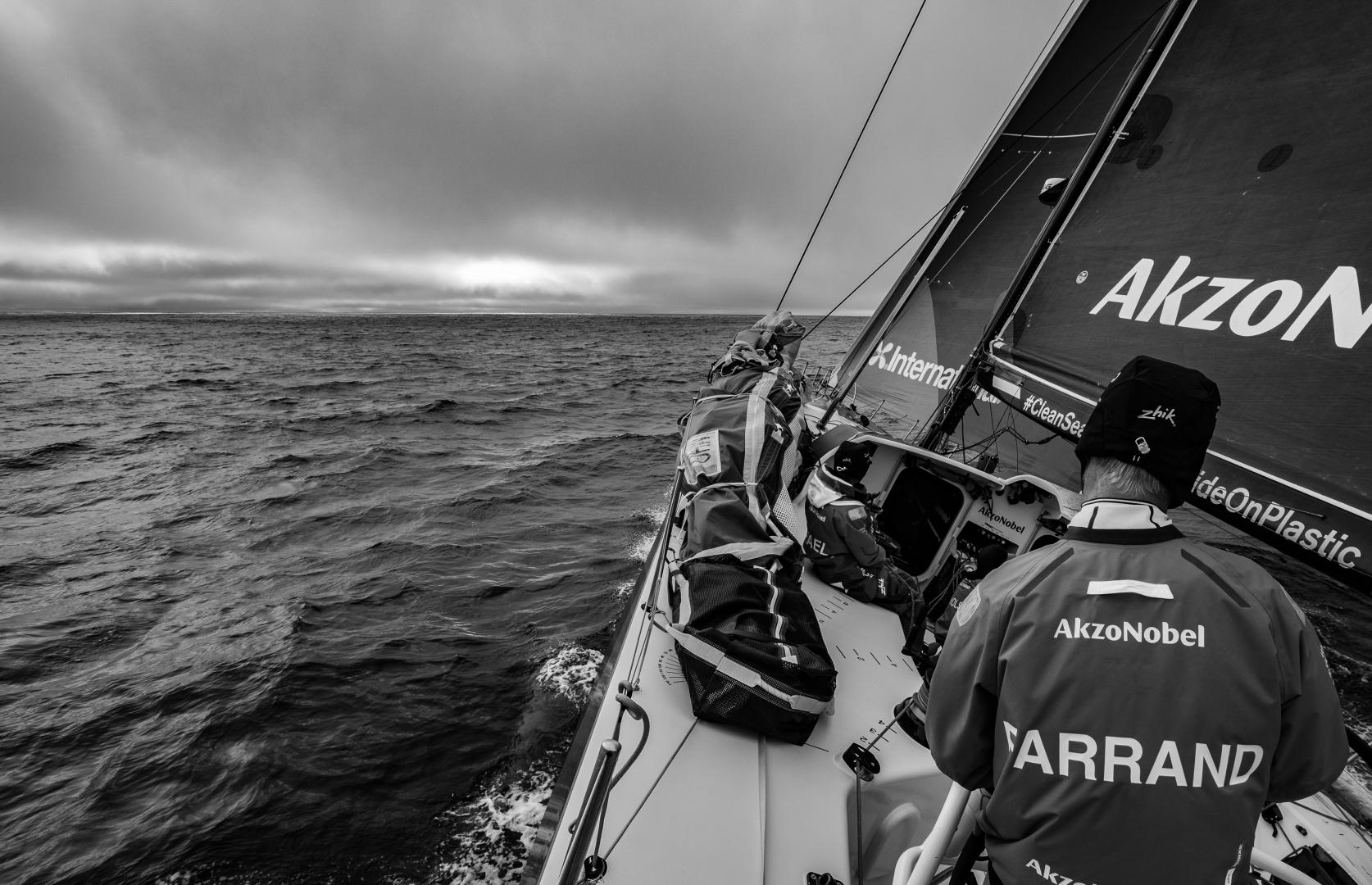 Volvo Ocean Race Leg 02, Lisbon to Cape Town, day 19, on board AkzoNobel. Brad Farrand on the helm heading towards some cold looking clouds.