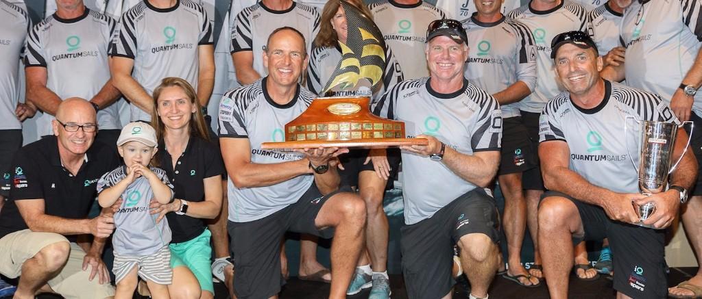 Doug Devos and Terry Hutchinson lifting the 2017 Quantum Key West Race Week trophy.