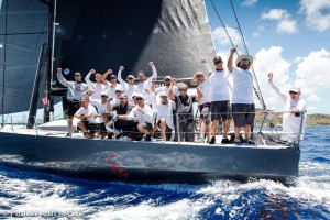 A victorious Warrior crew at the finish of the 2018 Peters & May Round Antigua Race