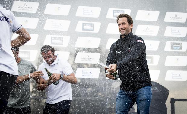 Sir Ben Ainslie celebrates his victory in the traditional manner