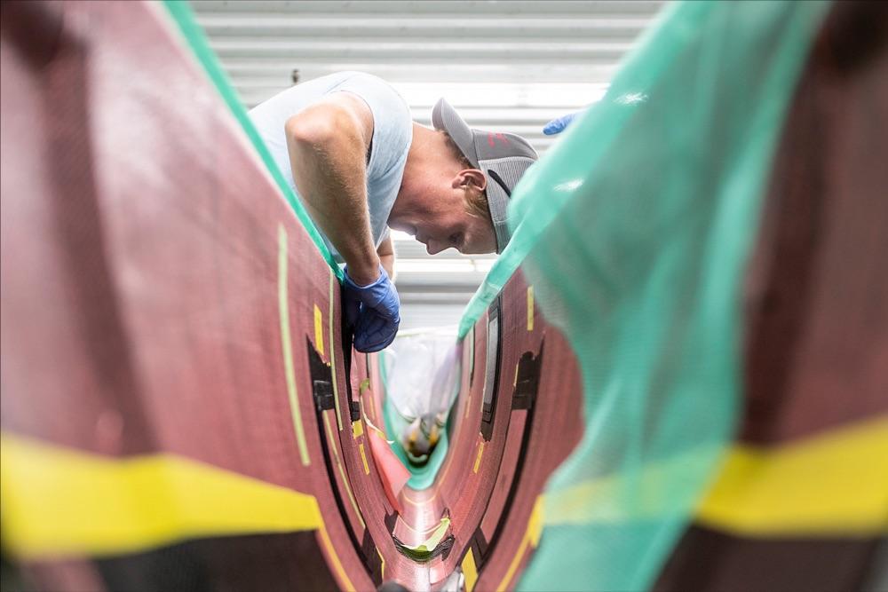 IYRS graduate and American Magic boatbuilder James Allsopp (Annapolis, Md.) works at the team’s production facility in Bristol, Rhode Island