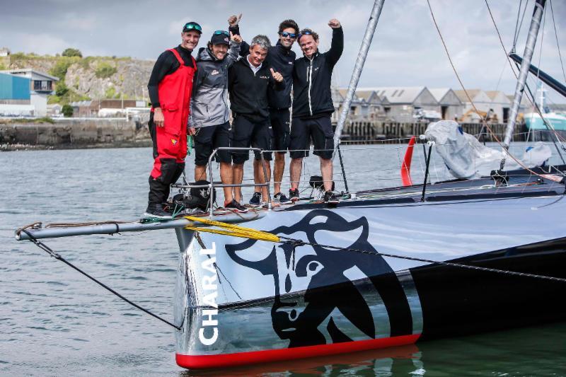 IMOCA 60 line honours for Jérémie Beyou and Christopher Pratt and their shore crew after arriving in Plymouth