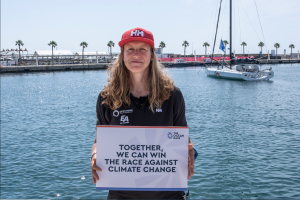 Annie Lush from Offshore Team Germany with climate change sign