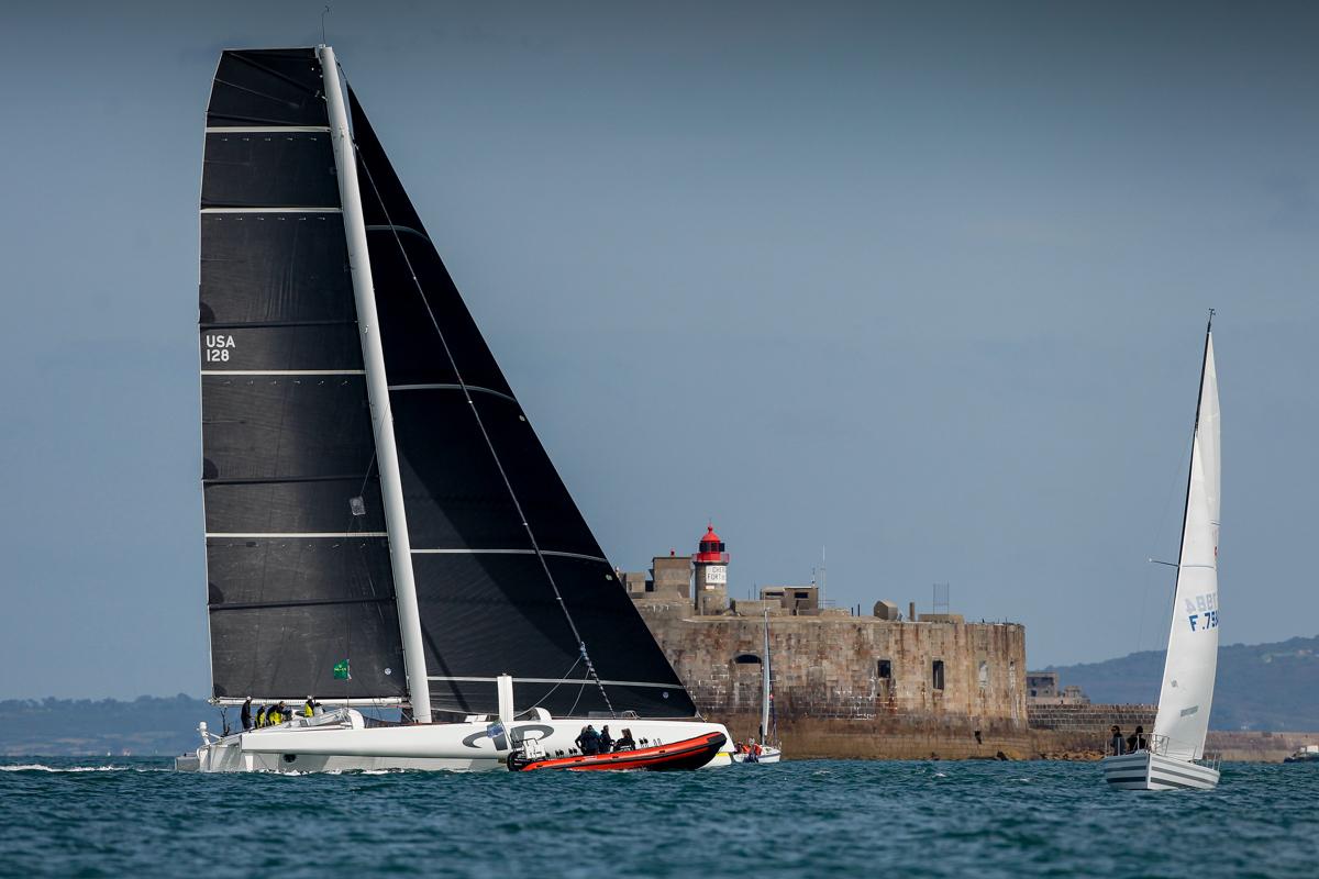 Jason Carroll's MOD70 Argo crosses the finish line off the light station on Fort De L'Ouest at 1522 BST © Paul Wyeth