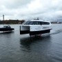 Candela's revolutionary electric C-8 leisure boat and P-12 ferry flying side by side, in Stockholm.