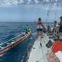 McIntyre OCEAN GLOBE 2023 - Drifting mariner coming alongside OGR entrant Outlaw whove suspended racing to divert to Dakar. Credit: Matt Sinnett-Jones Outlaw/Spirit of Adelaide/OGR2023