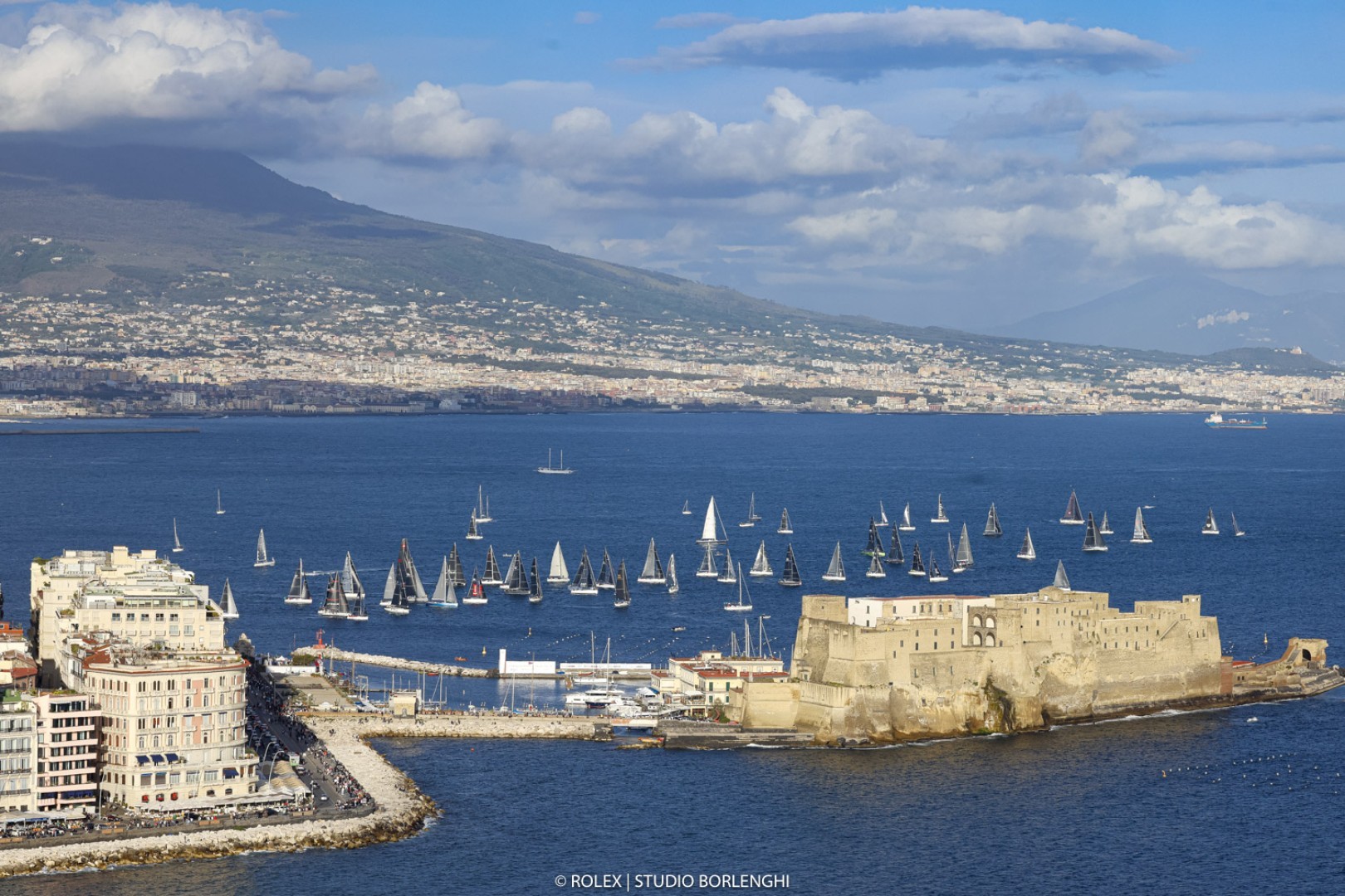 Last year's Regata dei Tre Golfi sets sail from off Santa Lucia. The infamous Mount Vesuvius is in the background.